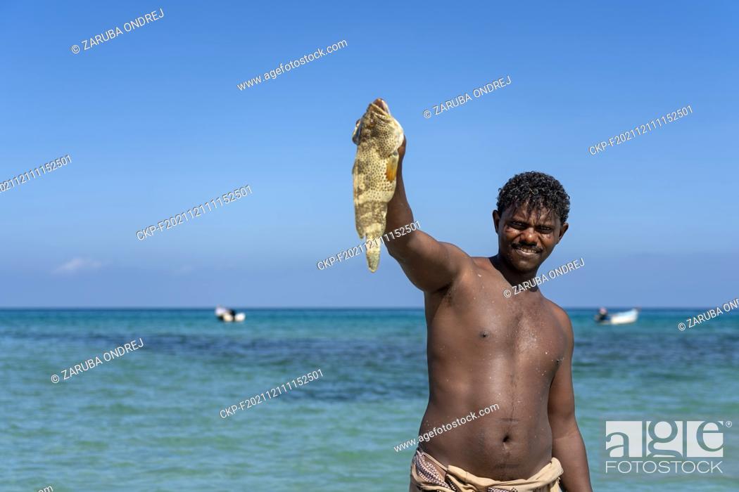Stock Photo: Fisherman with fish close to capital city Hadiboh in Yemen, October 21, 2021. (CTK Photo/Ondrej Zaruba).