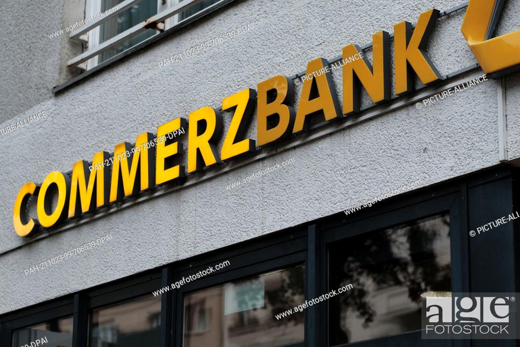 Stock Photo: 12 October 2021, Berlin: Part of the illuminated letters of the Commerzbank lettering above a recently closed branch on Kottbusser Damm in the Kreuzberg.