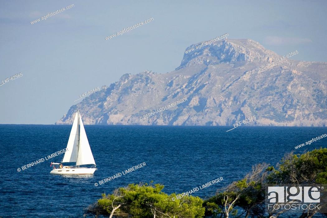 Stock Photo: Sailing boat off shore, Cap des Pinar, mountain Atalaia d'Alcudia, Majorca, Balearic Islands, Spain, Europe.