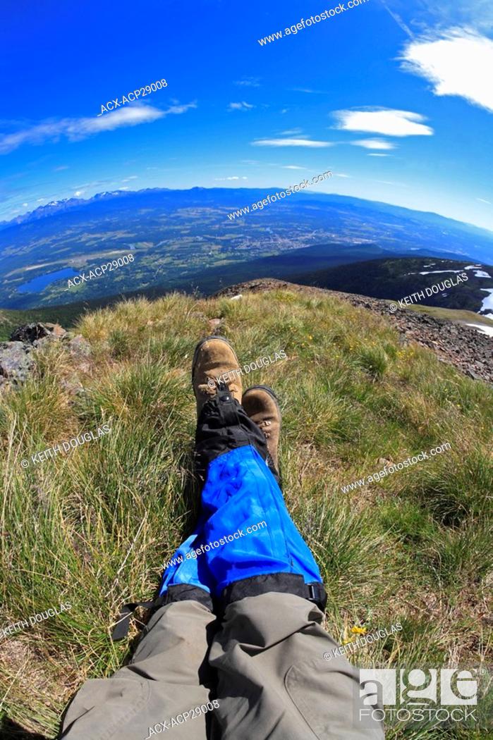 Stock Photo: Wide angle view of hikers boots in alpine area overlooking the Bulkley Valley, Smithers, British Columbia.