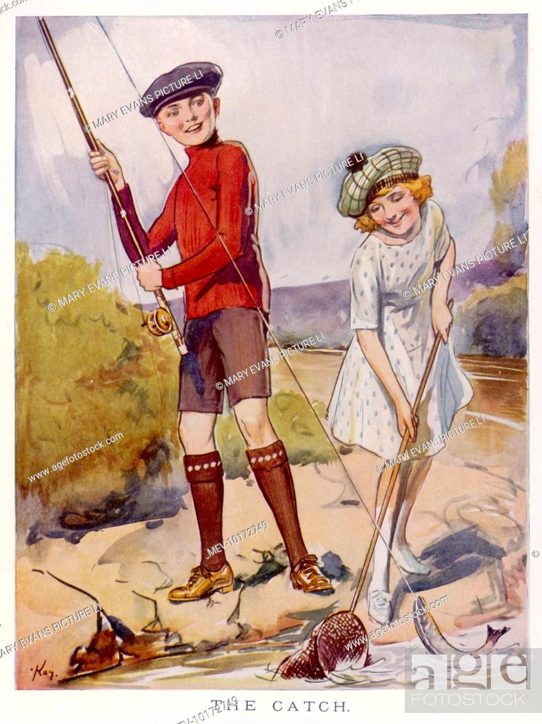 Stock Photo: A boy catches a fish from the river and his girl companion helps to net it.