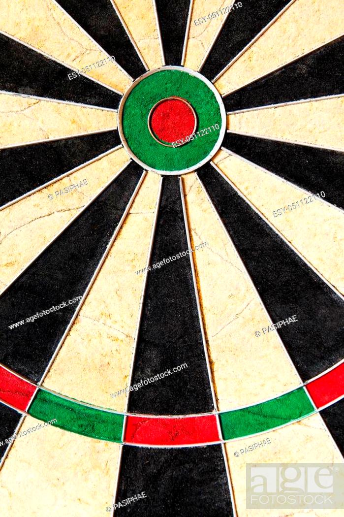 Stock Photo: closeup of an dartboard with triples and bullseye.