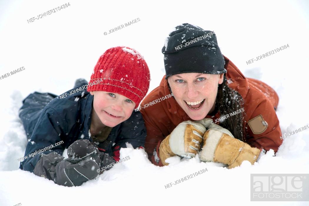 Stock Photo: Mother with son on snow.