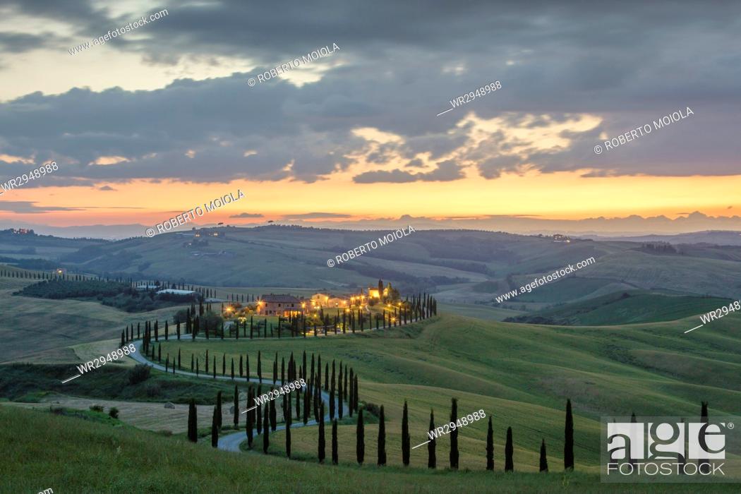 Stock Photo: Dusk on green hills surrounded by cypresses and farm houses, Crete Senesi (Senese Clays), province of Siena, Tuscany, Italy, Europe.
