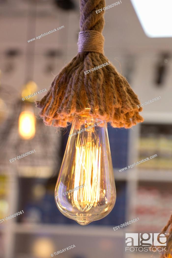 Stock Photo: Decorative antique edison style filament light bulbs hanging.