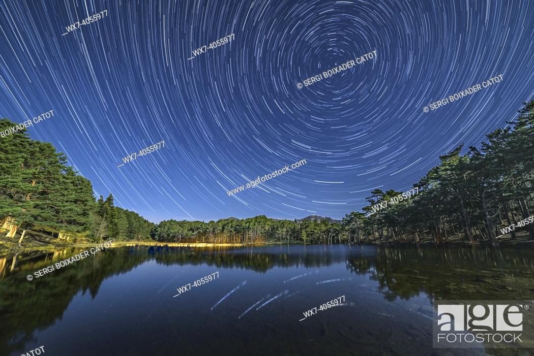 Stock Photo: Full Moon night in the Bassa d'Oles lake (Aran Valley, Catalonia, Spain, Pyrenees) .