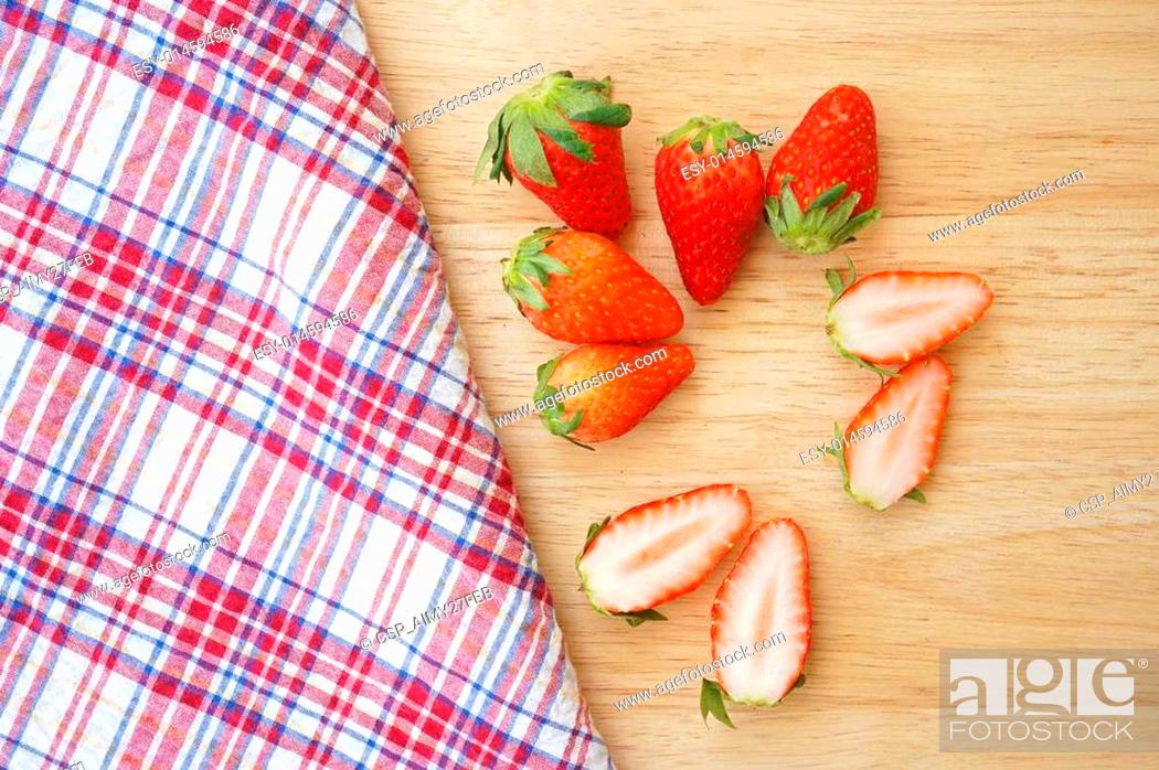 Stock Photo: Fresh strawberries on wooden plate.
