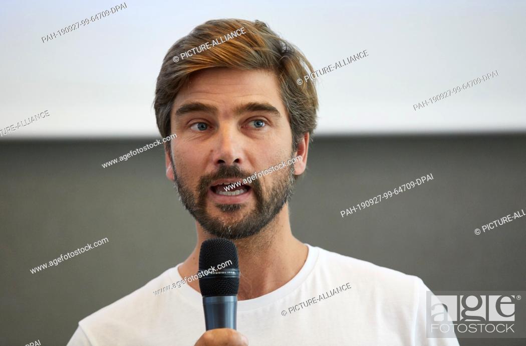 Stock Photo: 27 September 2019, Hamburg: Boris Herrmann, sailor, gives a laudation during the conference Seadevcon during the Hamburg Climate Week.