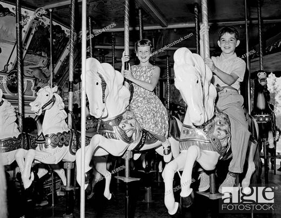 Photo de stock: Children on carousel.