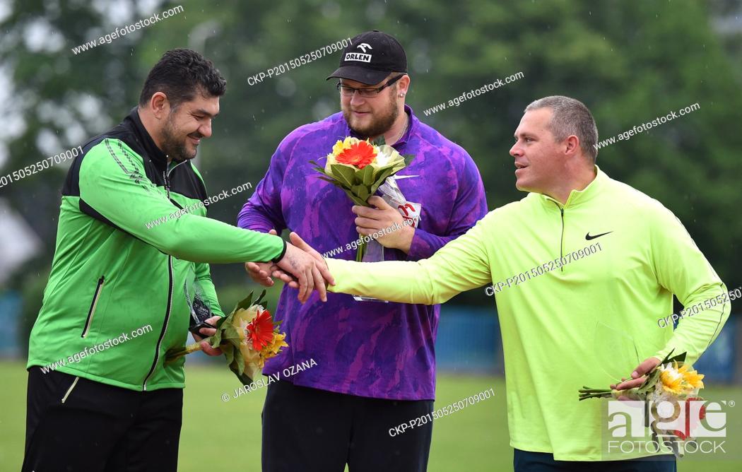 Stock Photo: From left: second placed Dilshod Nazarov of Tajikistan, winner Pawel Fajdek of Poland and third placed Krisztian Pars of Hungary celebrate after the winning a.