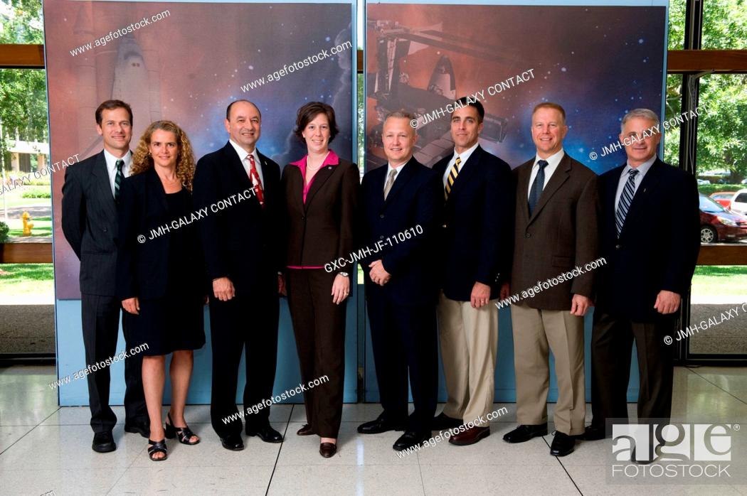 Stock Photo: STS-127 crew members along with flight director Holly Ridings (fourth from the left) pose for a portrait following a preflight press conference at NASA's.