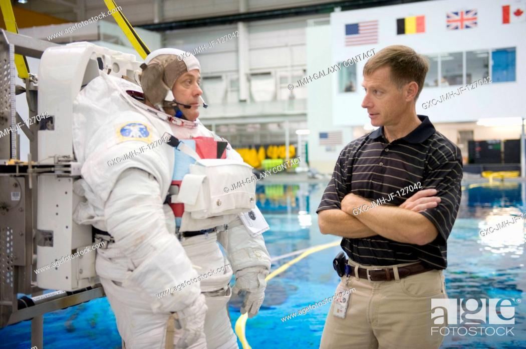 Stock Photo: NASA astronaut Ron Garan, Expedition 2728 flight engineer, attired in a training version of his Extravehicular Mobility Unit (EMU) spacesuit.