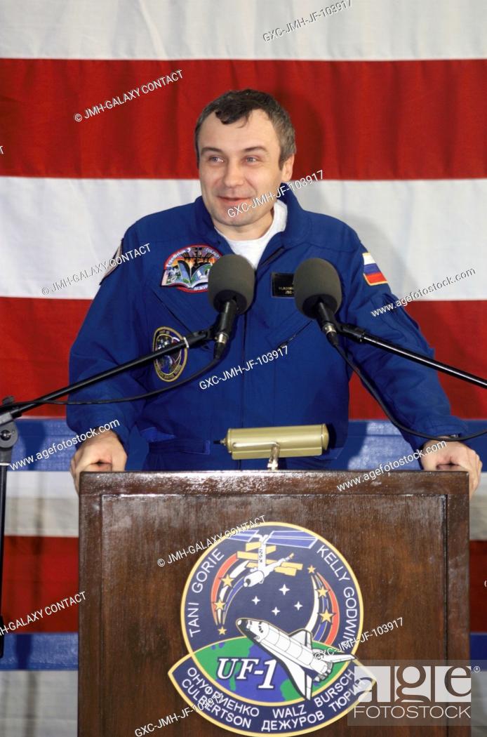 Stock Photo: Cosmonaut Vladimir N. Dezhurov, Expedition Three flight engineer representing Rosaviakosmos, speaks from the podium in Hangar 990 at Ellington Field during the.