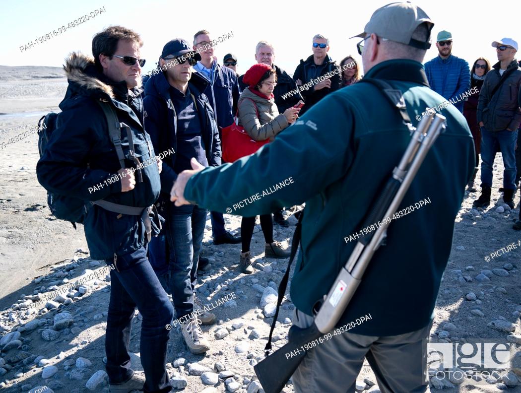 Stock Photo: 15 August 2019, Canada, Pond Inlet: Federal Foreign Minister Heiko Maas (2nd from left, SPD) and Markus Rex (left), climate researcher at the Alfred Wegener.