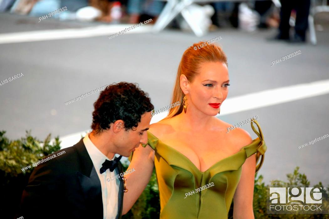Stock Photo: Actress Uma Thurman and designer Zac Posen arrive at the Costume Institute Gala for the ""Punk: Chaos to Couture"" exhibition at the Metropolitan Museum of Art.