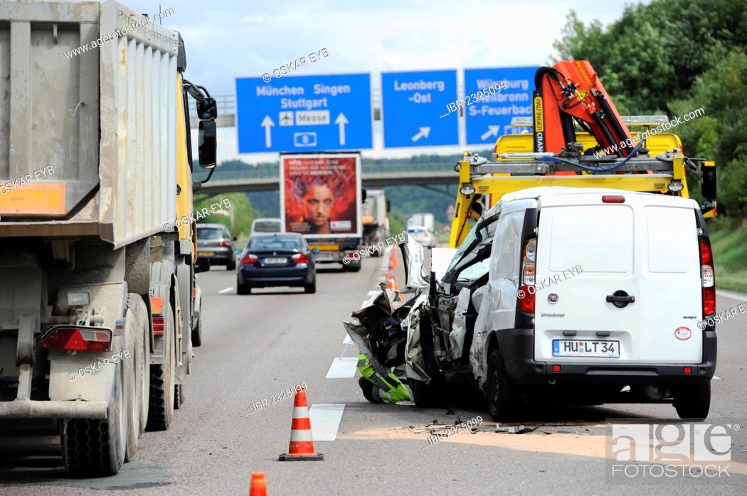 Stock Photo: A heavily damaged van is recovered after an accident on the A8 road near Leonberg by a tow truck, Baden-Wuerttemberg, Germany, Europe.
