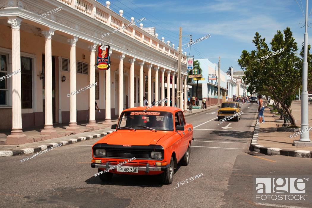 Stock Photo: Old cars in the main avenue Prado at town center, Cienfuegos, Cienfuegos Province, Cuba, West Indies, Central America.