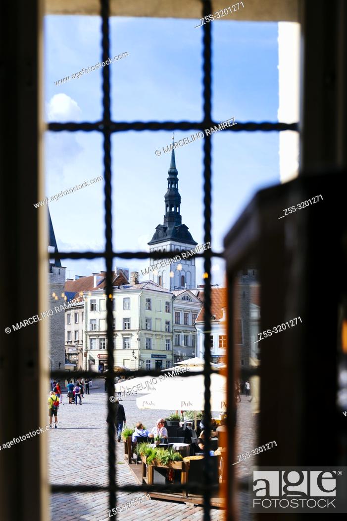 Stock Photo: The town hall square seen from a pharmacy window and the bell tower of the church of St. Nicholas. Tallinn, Harju County, Estonia, Baltic states, Europe.