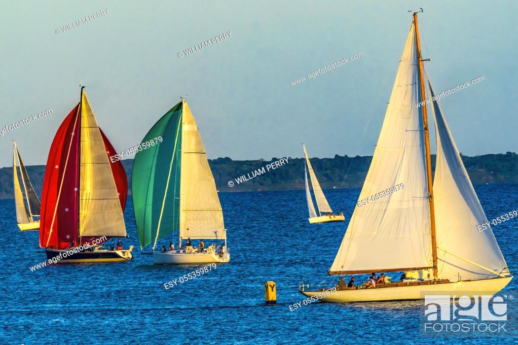 Stock Photo: Wednesday Evening Races Rounding the Yellow Buoy Colorful Sailboats Spinnakers Racing Padanaram Harbor Buzzards Bay Dartmouth Masschusetts.