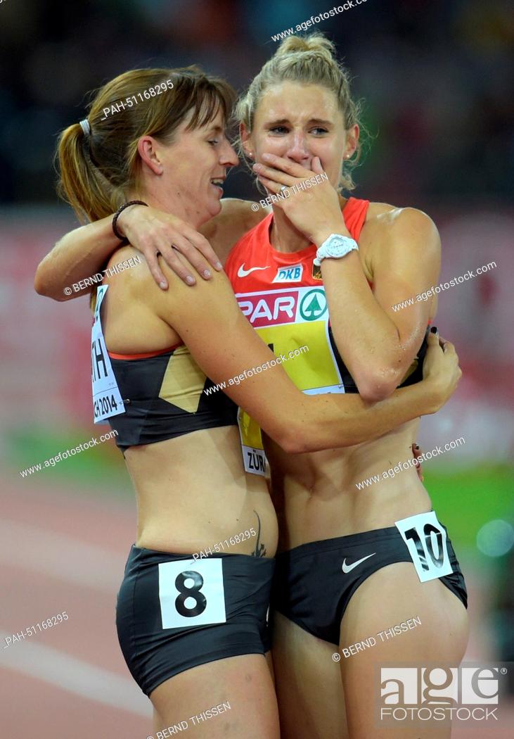 Stock Photo: Carolin Schaefer (R) of Germany and teammate Claudia Rath embrace each other after the women's 800m race of the heptathlon competition during the European.