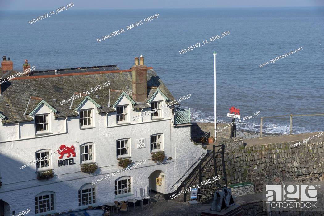 Stock Photo: Clovelly, North Devon, England, UK. March 2019, Red Lion a seafront hotel in the village community on the north devonshire coast.
