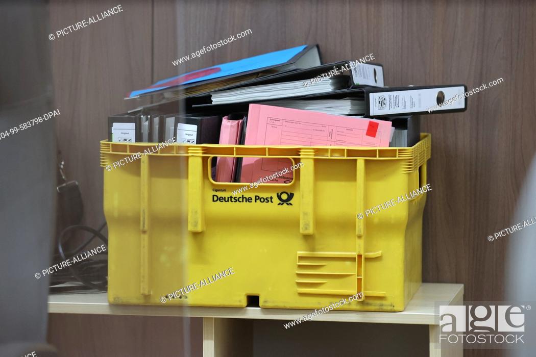Stock Photo: 04 January 2022, Thuringia, Gera: Files lie in a mailbox in the courtroom of the district court building. Here, an 18-year-old defendant is being tried.