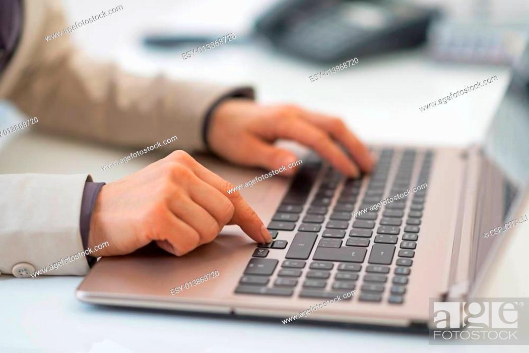 Stock Photo: Closeup on business woman working on laptop.
