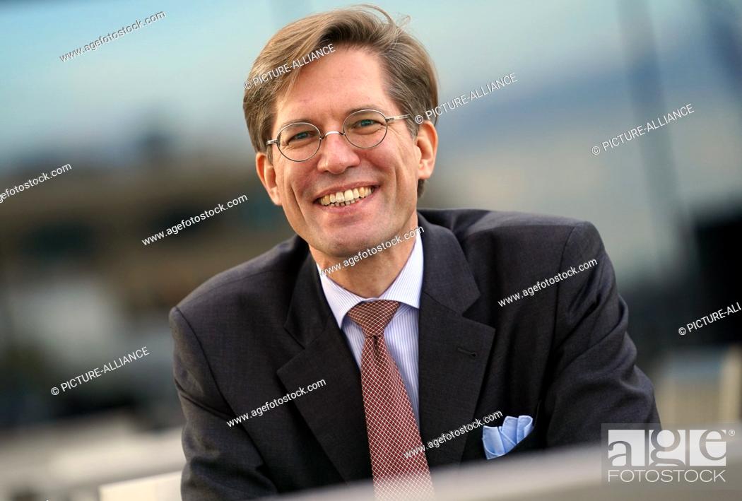 Stock Photo: 02 November 2021, Hamburg: Nils Weiland, deputy chairman of the Hamburg SPD, sits on a roof terrace in Hafencity. The Hamburg SPD is to be led by a dual.