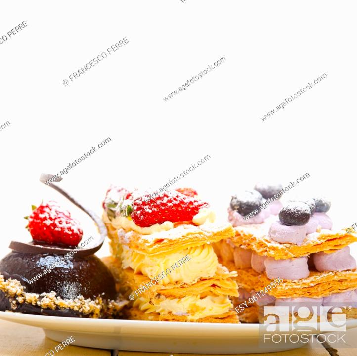 Stock Photo: selection of fresh cream napoleon and chocolate mousse cake dessert plate.