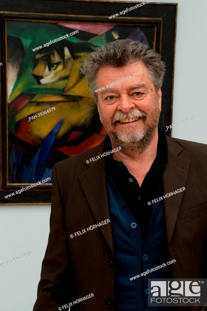 Stock Photo: Museum director Helmut Friedel poses in front of the painting 'Tiger' by Franz Marc in the new Lenbachhaus in Munich, Germany, 06 May 2013.