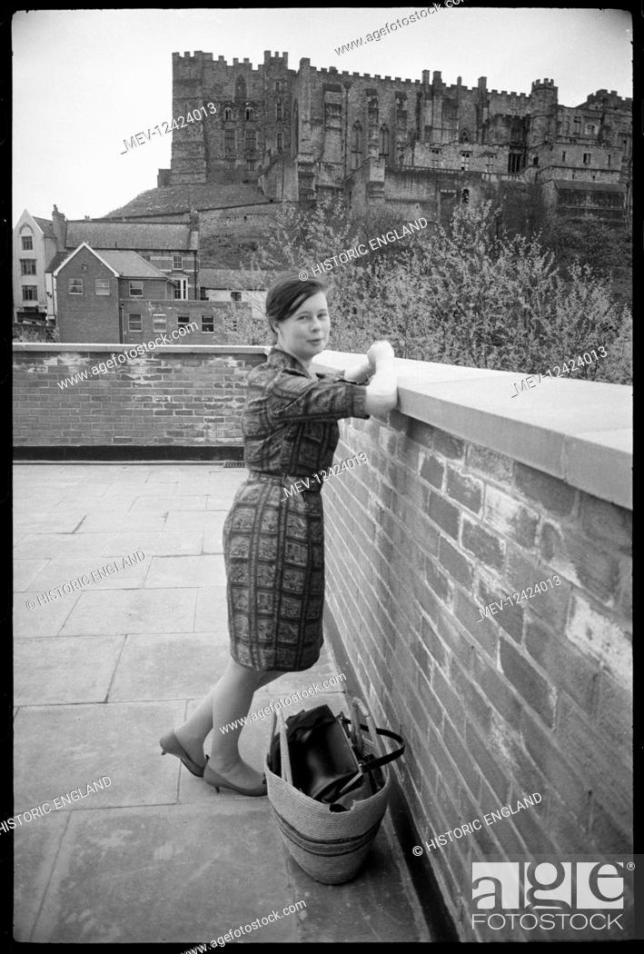 Stock Photo: A portrait of Ursula Clark, with Durham Castle in the background, taken from near Bridge House on the western side of Framwellgate Bridge, looking east.
