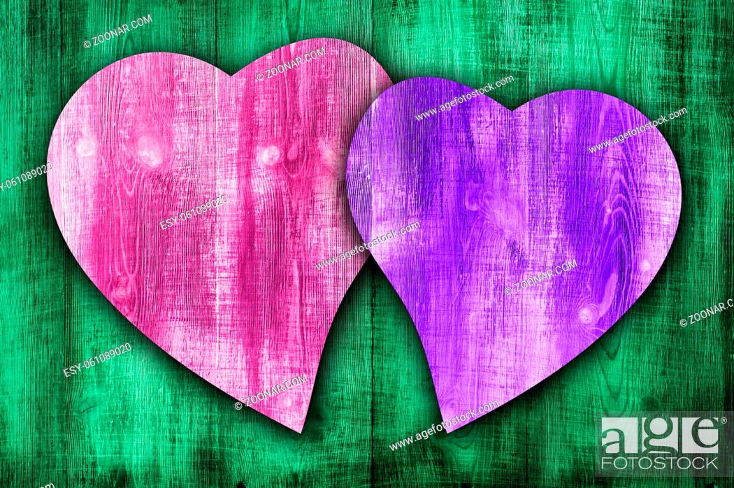 Stock Photo: Happy valentines day colorful wooden background with coloured hearts.