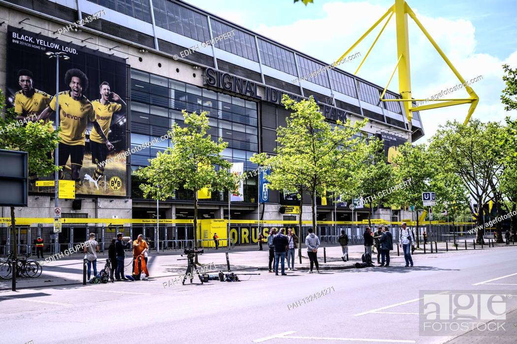 Stock Photo: Journalists and photographers who have not received accreditation are waiting in front of the stadium. GES / Football / 1st Bundesliga: Borussia Dortmund - FC.