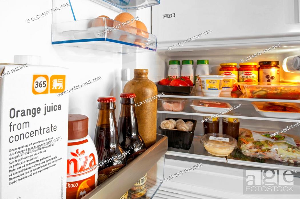 Cooled Food And Beverages In Open Fridge Refrigerator In Kitchen Stock Photo Picture And Rights Managed Image Pic Plp 130318p219 Agefotostock