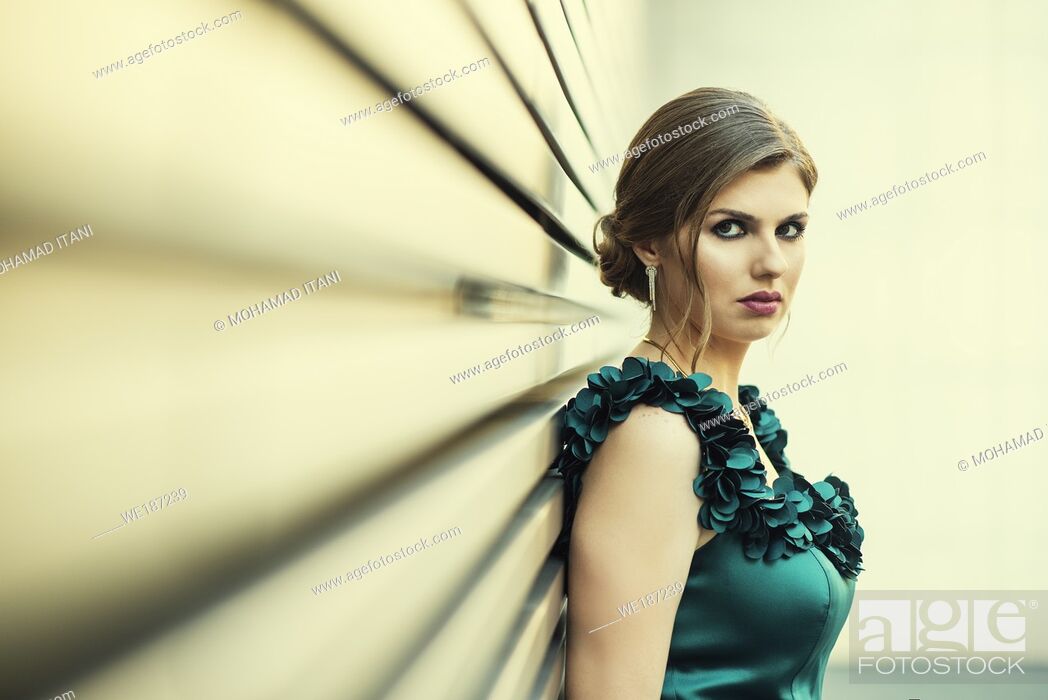 Stock Photo: Serious woman looking at camera outdoors.