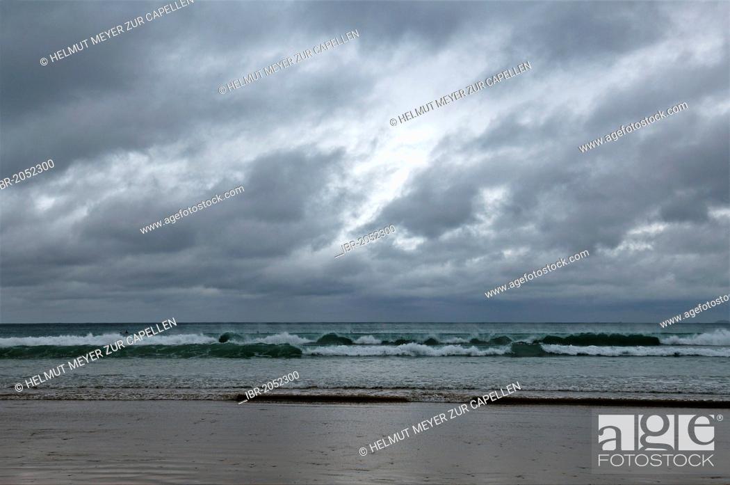 Stock Photo: Surfers waiting for waves during stormy weather on the coast of Newquay, Cornwall, England, United Kingdom, Europe.