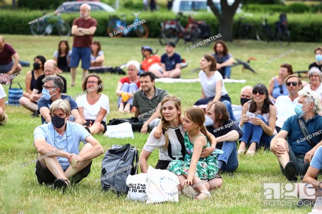 Stock Photo: Illustration shows people at a protest organised by citizen's collective Grondrecht, at the Boeienweide, Linkeroever, in Antwerp, Tuesday 15 June 2021.