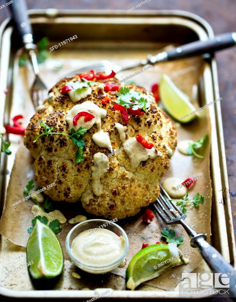 Stock Photo: Gratinated cauliflower with red peppers and mustard dip.