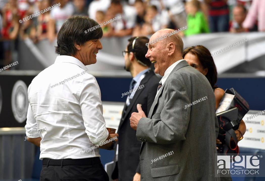 Stock Photo: Germany's head coach Joachim Loew (L) talks to German former soccer player Horst Eckel prior to the international soccer friendly match between Germany and.