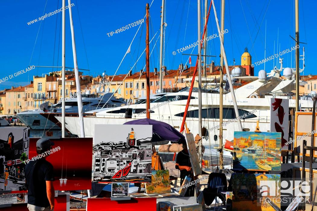 Stock Photo: France, Saint Tropez, painters selling their art on Quai Jean Jaurés.