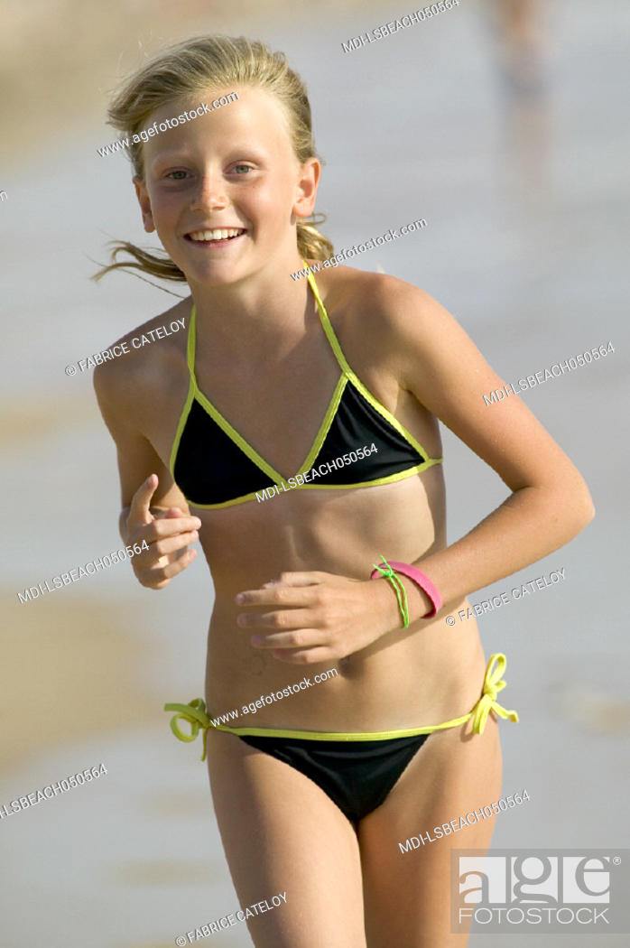 Little girl running on the beach, Stock Photo, Picture And Rights Managed  Image. Pic. MDI-LSBEACH050564 | agefotostock