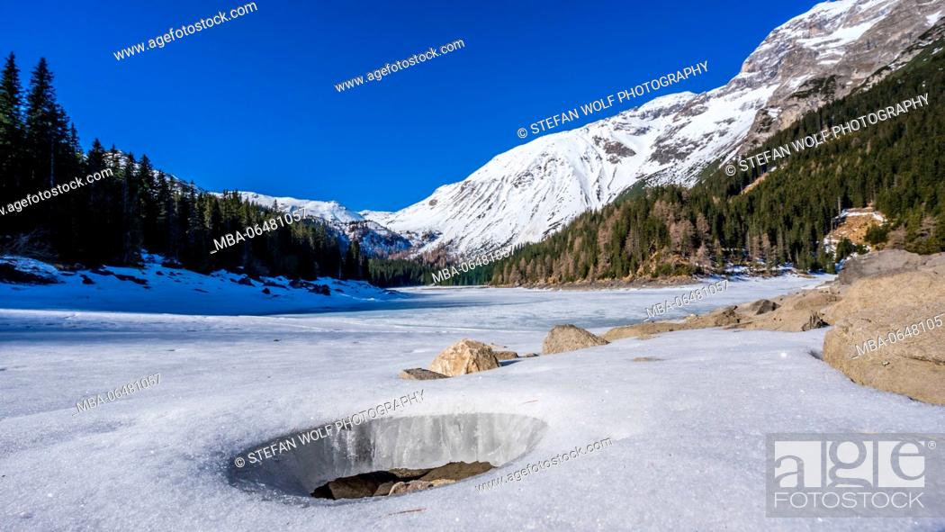 Stock Photo: Obernberger lake in winter, with Obernberg at the Brenner Pass, the Stubai Alps, Tyrol, Austria.
