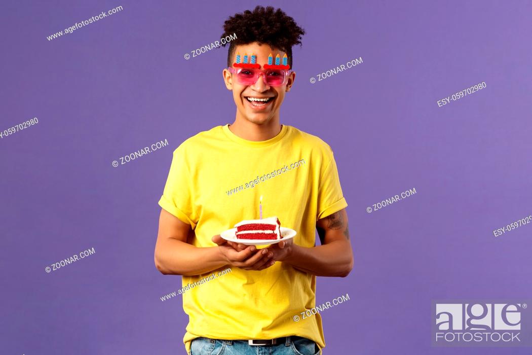 Stock Photo: Celebration, party and holidays concept. Portrait of upbeat, charismatic lively man with dreads, hipster guy wearing funny glasses mask celebrating birthday.