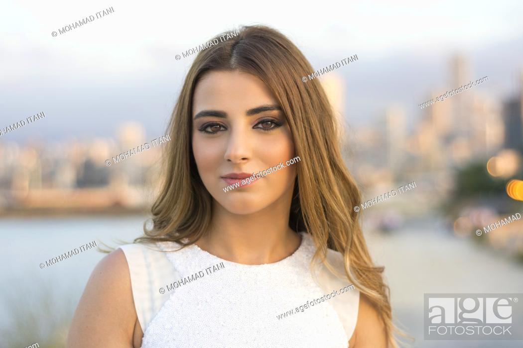 Stock Photo: Portrait of a beautiful woman outdoors.