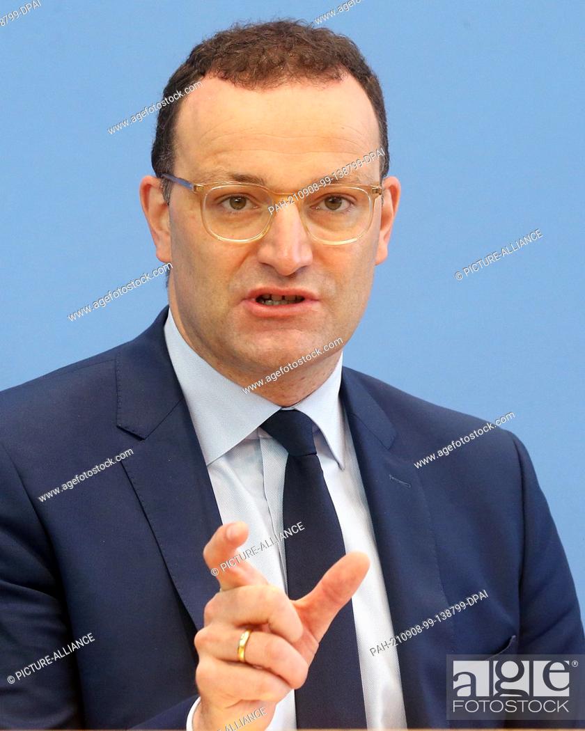 Stock Photo: 08 September 2021, Berlin: Jens Spahn (CDU), Federal Minister of Health, answers questions from journalists during a press conference on the Corona vaccination.
