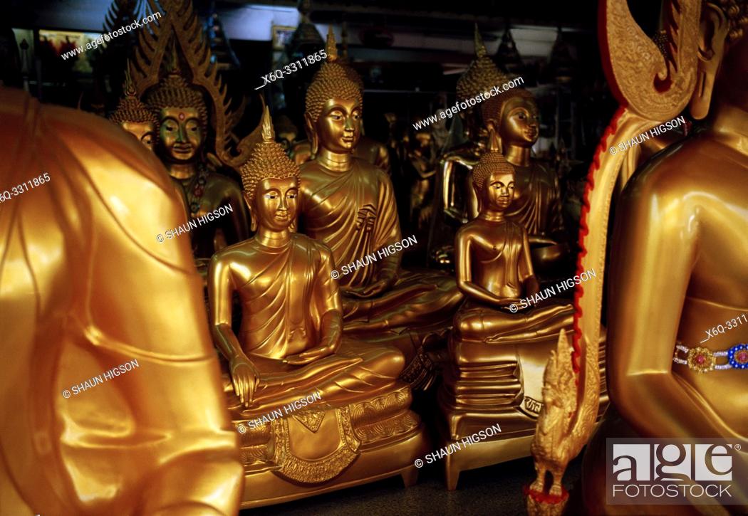 Stock Photo: Buddha statues in Bamrung Muang Road in Bangkok in Thailand in Southeast Asia Far East. Bamrung Muang Road is a place in Bangkok where the statues of the Buddha.