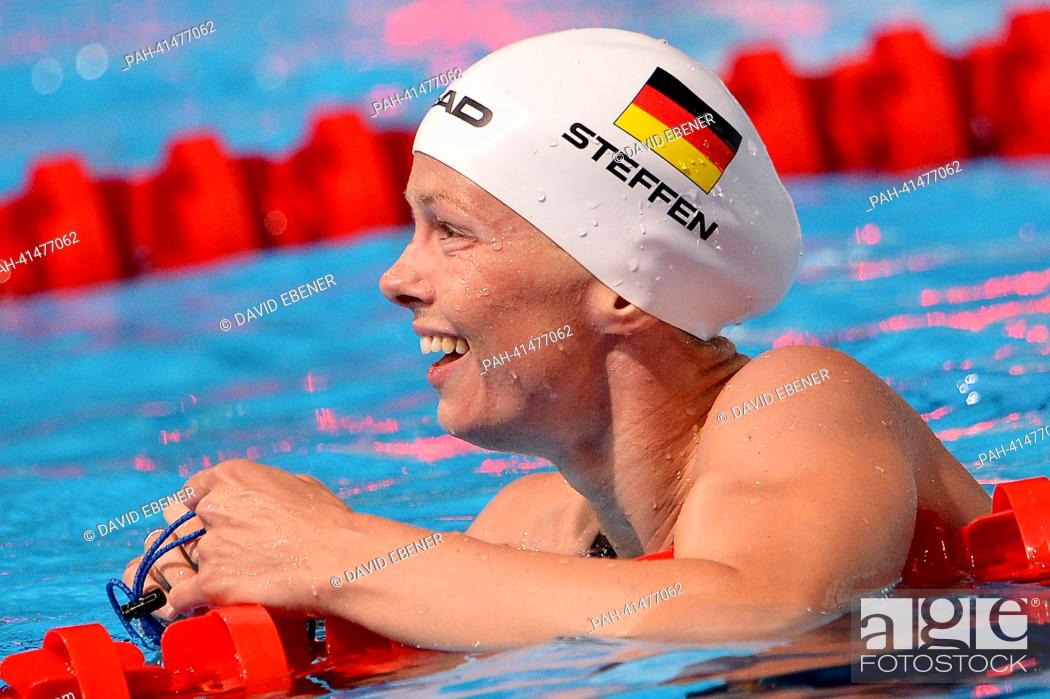 Stock Photo: Britta Steffen of Germany smiles after the women's 100m Freestyle final during the 15th FINA Swimming World Championships at Palau Sant Jordi Arena in Barcelona.