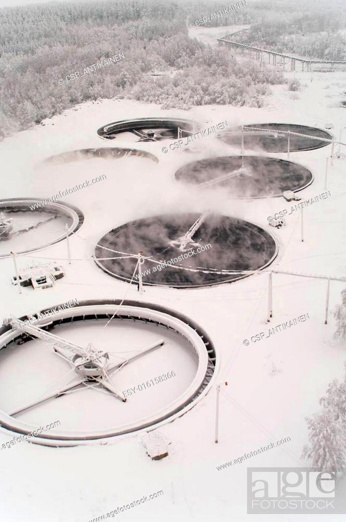 Stock Photo: Snow covered sedimentation tanks with sewerage.