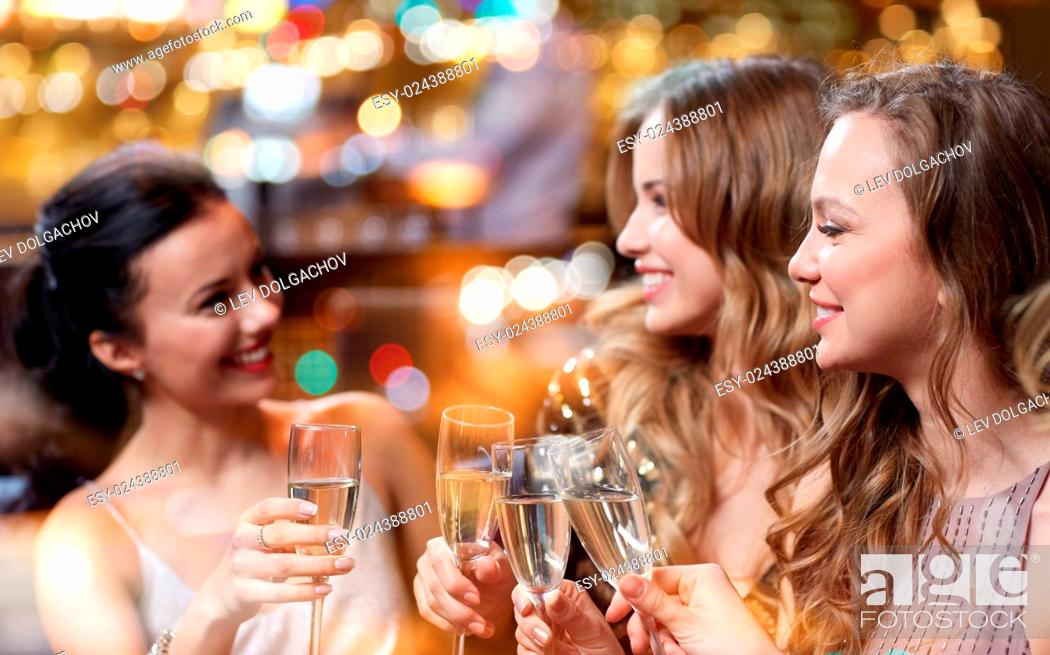 Stock Photo: celebration, friends, bachelorette party and holidays concept - happy women with champagne glasses at night club.