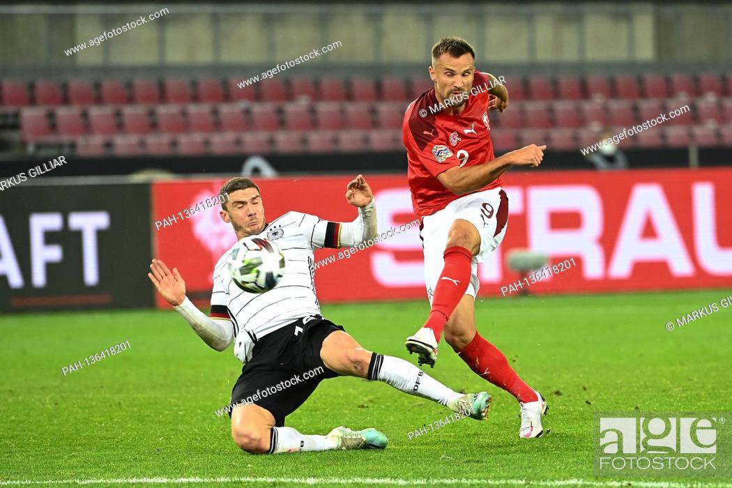 Stock Photo: Haris Seferovic (Switzerland) versus Robin Gosens (Germany). GES / Soccer / UEFA Nations League: Germany - Switzerland, 10/13/2020 Football / Soccer: UEFA.
